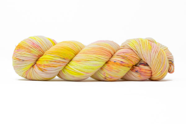 Multicolored skein of yarn on a white background