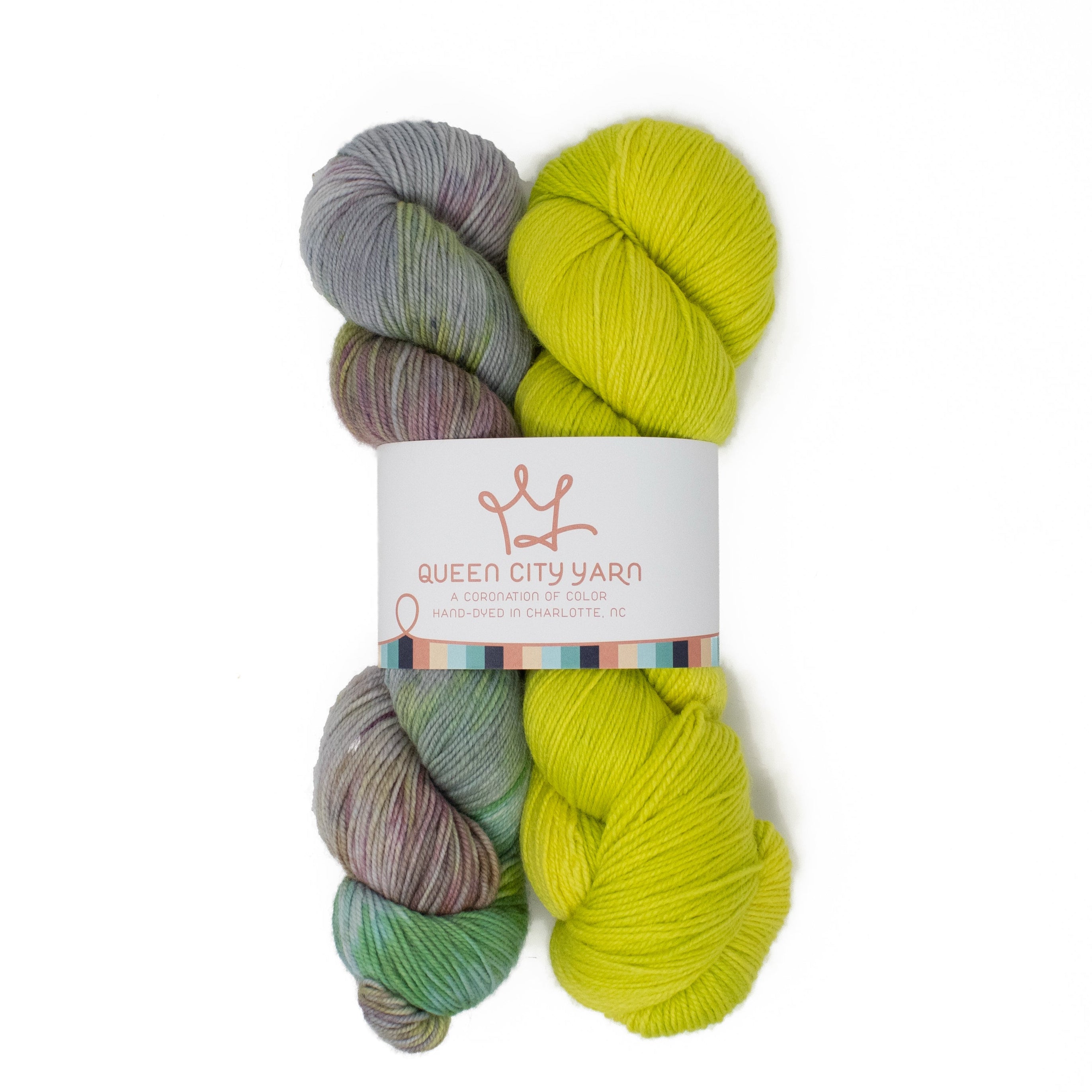 Two skeins of yarn, one multicolored and one bright yellow, with a 'Queen City Yarn' label on a white background.